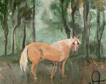 Palomino en su pasto