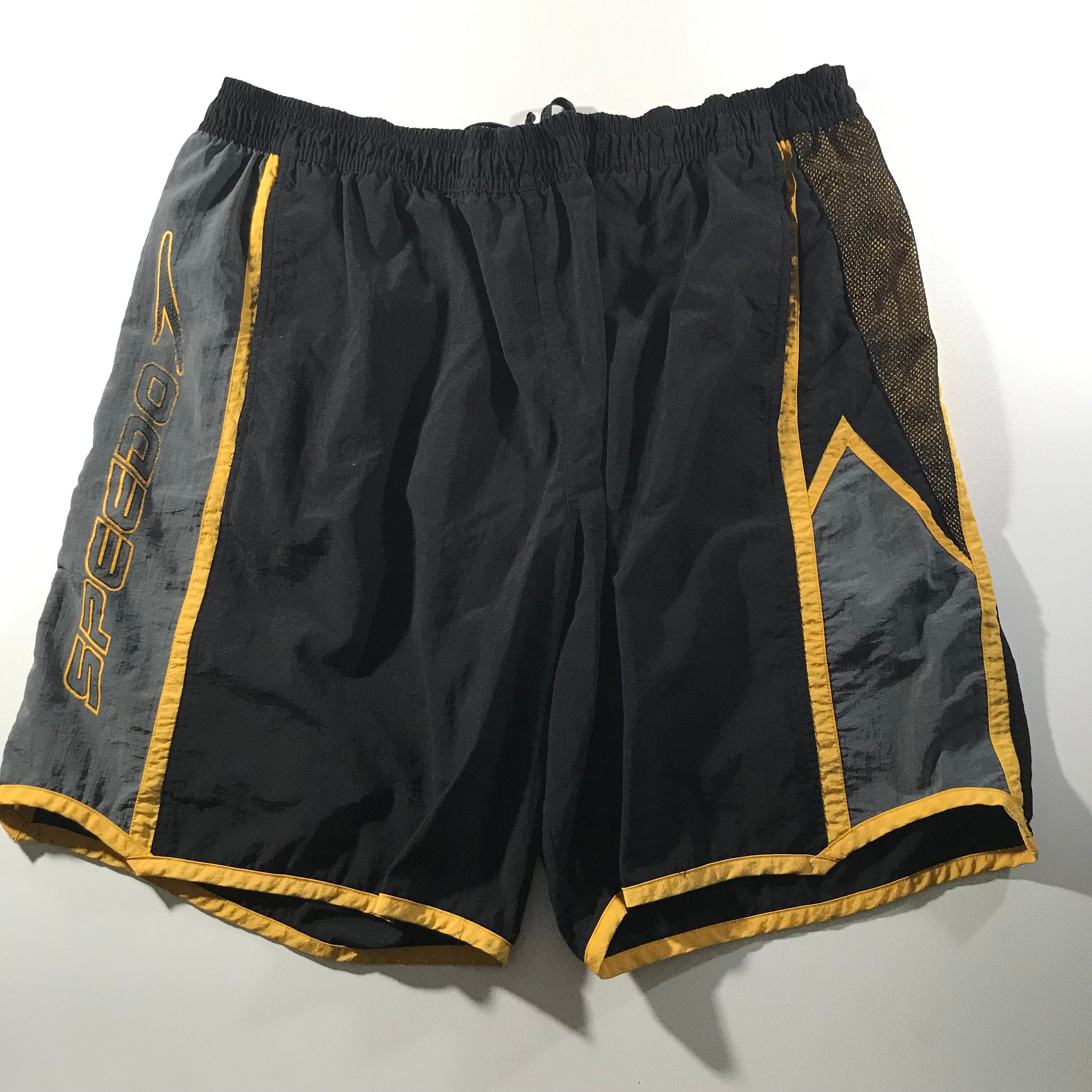 black and yellow swim trunks