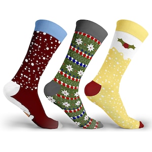 May include: Three pairs of festive socks. One sock is burgundy with white polka dots and a light blue cuff. Another is green with white snowflakes and red and blue accents. The third is yellow with white dots and a holly berry design.