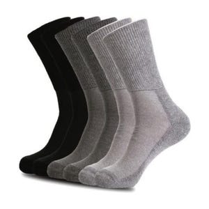 May include: A set of six crew socks in black and gray. The socks are made of a soft, comfortable material and are perfect for everyday wear.