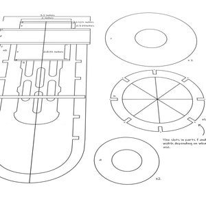 May include: A line drawing of a template for a wooden toy. The template includes a long, narrow piece with a rounded bottom, two smaller circles, and a larger circle with eight slots around the edge. The text "The slots in parts f and h vary in width depending on what material is used." is included in the drawing.