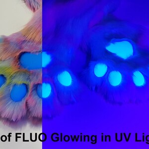 May include: A pair of fluffy rainbow colored paws with blue glow-in-the-dark accents. The paws are shown under a UV light, highlighting the blue glow.