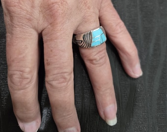 Sterling Silver inlayed with sleeping Beauty Turquoise,  Ring was designed by David Rosales