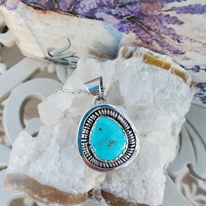Lone Mountain Turquoise Pendant handcrafted by Navajo Artist Terry Charlie.