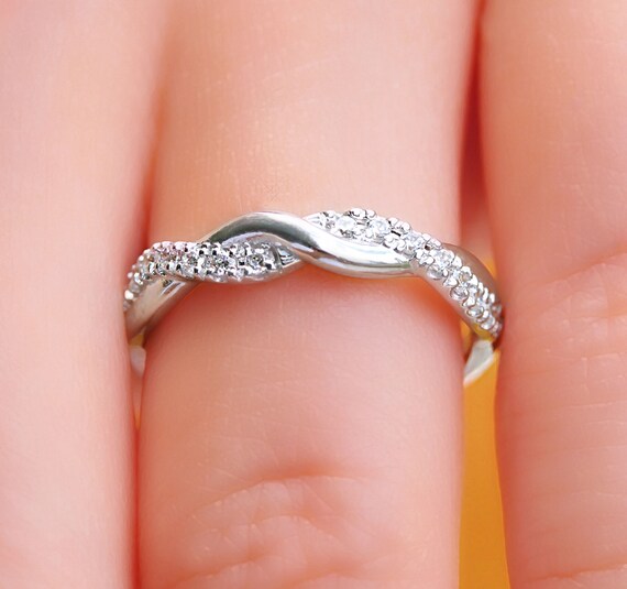 Twist engagement ring discount with wedding band