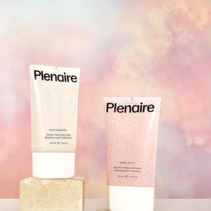 May include: Two Plenaire skincare products on stone blocks. One is white with the text "SKIN FROSTING" and "Deeply hydrating mask". The other is pink with "ROSE JELLY" and "Gentle makeup remover". Both are 100 ml / 3.4 fl oz.