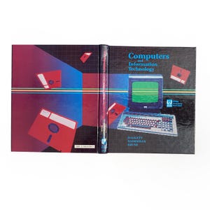 May include: A vintage book titled "Computers and Information Technology" with a retro design. The cover features a computer illustration, red floppy disks, and a blue and red gradient background. The book's spine is visible.