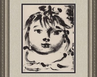 May include: Black and white abstract portrait of a child's face. The artwork is framed in a silver-colored ornate frame with a beige linen-textured mat.