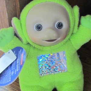 Green lime Dipsy  teletubbies rubber face doll plush holographic belly  Play along tags attached