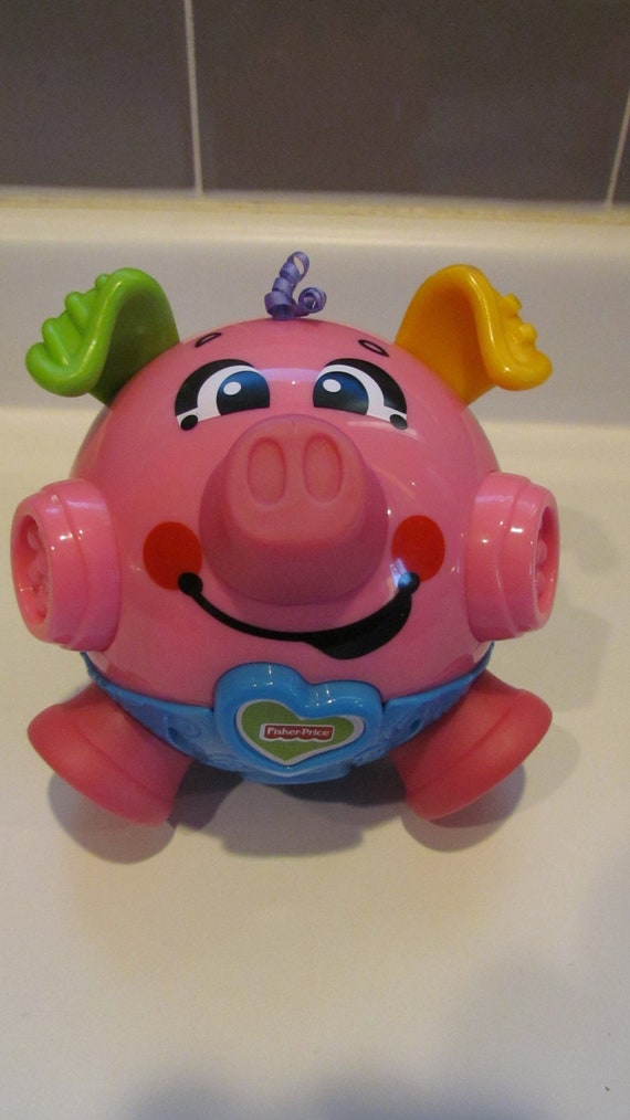 Fisher Price Brilliant Basics Bounce Giggle Pig sons