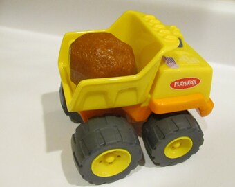 2002 Hasbro Rock Dump Truck Vintage toy Pull the rock and the truck shakes