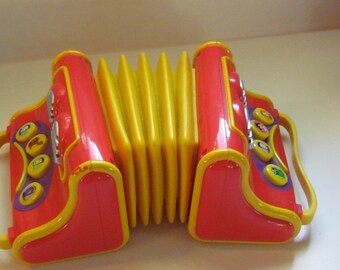 The Wiggle's Musical Accordian Toy Spinmaster kid's play music vintage toy