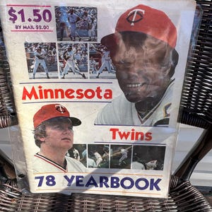 May include: A Minnesota Twins 78 Yearbook featuring a large portrait of a baseball player in a red cap with a TC logo, a smaller portrait of a player in a red cap, and several action photographs of baseball players on a white background.