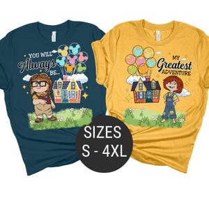 May include: Two graphic t-shirts, one navy blue and one yellow, featuring characters and houses from the animated film "Up." The navy shirt says "You Will Always Be..." and the yellow shirt says "My Greatest Adventure." Both shirts have the sizes S-4XL.