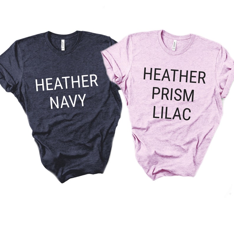 May include: Two t-shirts, one navy blue and one pink, with the text "HEATHER NAVY" and "HEATHER PRISM LILAC" printed on them.