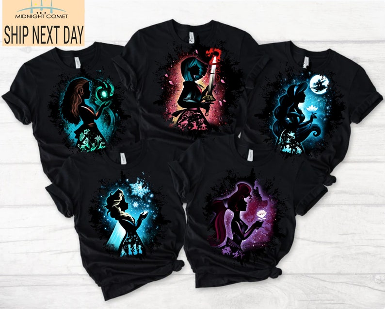 May include: Black t-shirts featuring colorful silhouette designs of animated characters. Each shirt showcases a different character with unique elements, such as glowing orbs, snowflakes, and floral accents. The text "MIDNIGHT COMET SHIP NEXT DAY" is visible.