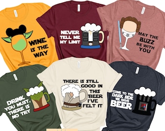 May include: Six different t-shirts with various Star Wars themed designs and sayings. The shirts are in different colors, including yellow, maroon, pink, green, beige, and blue. The designs include a glass of wine with Mickey Mouse ears, a beer mug with a Star Wars character, a glass of wine with Princess Leia, a beer mug with Yoda, a beer mug with a Star Wars character, and a beer mug with Darth Vader.