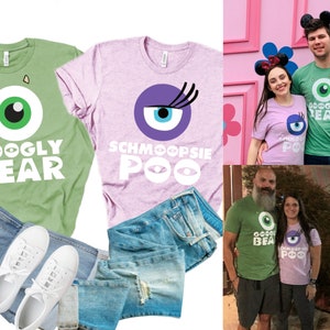 May include: Two couples wearing matching green and purple t-shirts with a cartoon eye and the text "Googly Bear" and "Schmoopsie Poo". The shirts are paired with blue jeans.