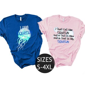 May include: Two t-shirts with a jellyfish graphic and text. The blue shirt says "I am squishy" and the pink shirt says "I shall call him squishy and he shall be mine and he shall be my squishy". The shirts are available in sizes S-4XL.