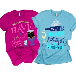 May include: Two t-shirts with a Frozen theme. The pink shirt says "Do you wanna have a cocktail?" with a cocktail glass and a shot glass. The blue shirt says "The wine never bothered me anyway" with a wine bottle pouring into a glass.