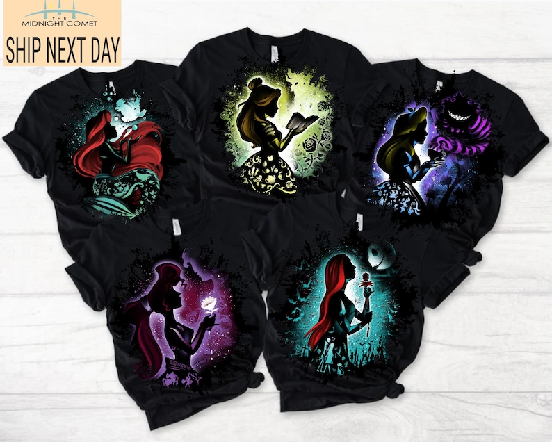 May include: Black t-shirts featuring colorful silhouette designs of Disney characters. The shirts display Ariel, Belle, Alice, and other characters. The text "MIDNIGHT COMET SHIP NEXT DAY" is at the top left.
