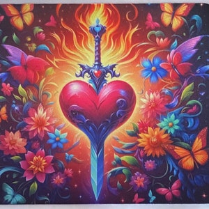 May include: A colorful mousepad with a red heart pierced by a sword, surrounded by flowers and butterflies. The heart and sword are surrounded by flames.