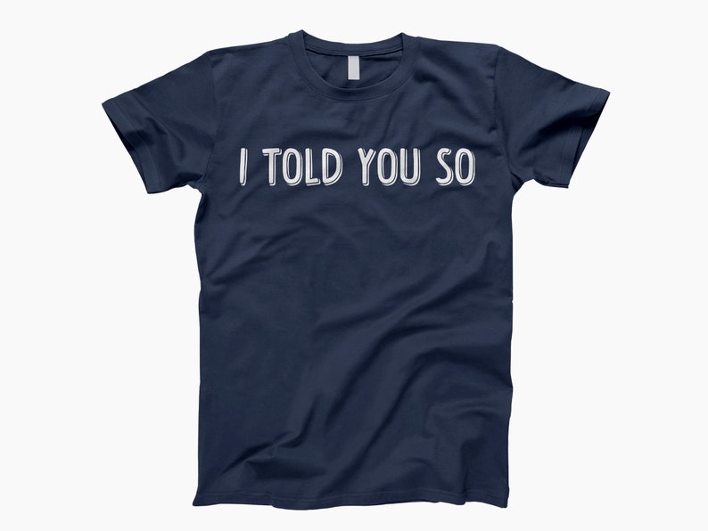 May include: A navy blue t-shirt with the text "I told you so" printed in white.