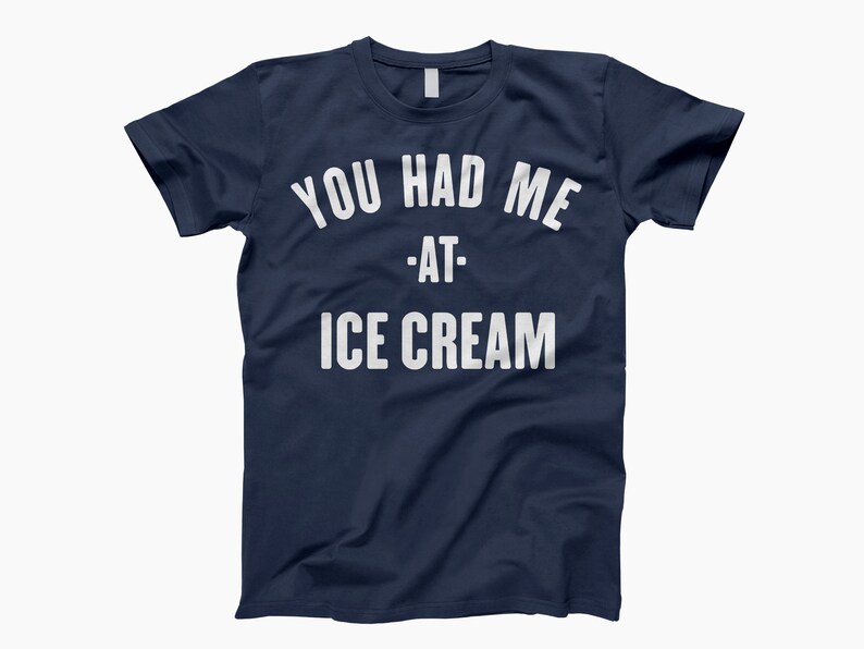 May include: A navy blue t-shirt with white text that reads "You had me at - ice cream".