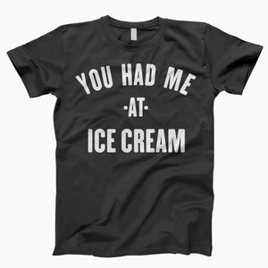 May include: Black t-shirt with white text that reads "You had me at - ice cream".