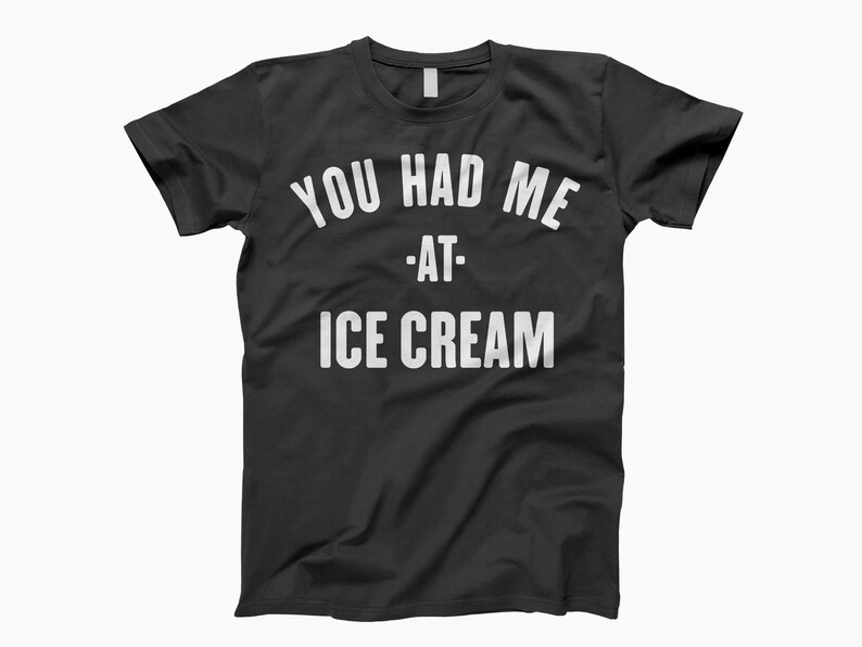 May include: Black t-shirt with white text that reads "You had me at - ice cream".
