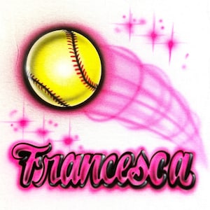 May include: A pink and yellow softball with a pink trail behind it. The name "Francesca" is written in pink with a black outline below the softball.