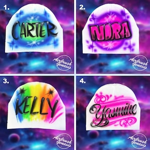 May include: Four white beanies with airbrushed names and designs. The names are Carter, Nora, Kelly, and Yasmine. Each beanie has a unique color scheme, including blue, purple, rainbow, and pink. The text "Airbrush Genesis" is at the bottom of each beanie.
