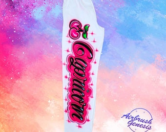 Diseño de pantalones deportivos con cerezas aerografiadas
