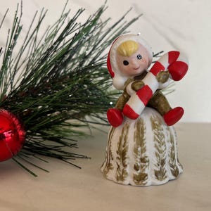 Vintage Pixie Elf Porcelain Bisque Christmas Figurine Bell. Marked with original sticker made in Tiawan.*Read size.
