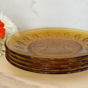 Bicentennial Anchor Hocking Glass Dinner Size Plates Amber Gold. Liberty Bell, Canon Plate, Eagle and US Seal. 1976. Set of Four.