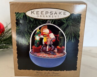 Hallmark Cards Ornament Magic  “ Home on the Range” Cowboy Santa and Rocking Horse Light Up Electric Ornament 1993