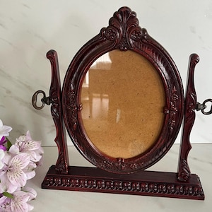 Vintage Frame with Stand. Plastic Composite Carved Ornate Wood Look. Marked British Registered Design I-L. Made in England. Made 1960’s
