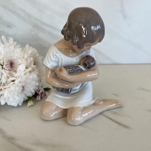 Royal Copenhagen Porcelain Figurine “Girl with Doll”. Denmark. Marked on bottom.#1938 /06 1970/1980’s.