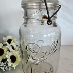 Antique Vintage Ball Clear Glass Mason Lightening Jar with Lid Metal Wire Bale. Marked Ideal. #13 on bottom. 1923- 1930