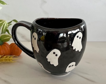 Anthropologie Collectible Halloween Ghost Mug. Black and White Ceramic. Anthropologie Sticker on bottom.