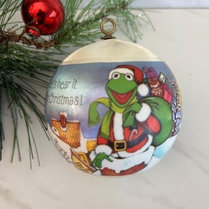 Vintage Miss Piggy and Kermit the Frog Round Spun Satin Christmas Ornament. “Merry Christmas 1981” Henson Associates Inc. 1981.