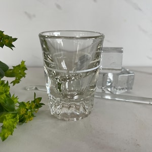 May include: A set of three ceramic mugs with a speckled, matte finish. The mugs are in shades of cream, light gray, and dark gray. Each mug has a simple, minimalist design, perfect for coffee or tea.