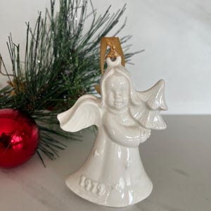 Goebel Hummel 1979 Angel Figurine Christmas Ornament. Marked on bottom W Germany with V .