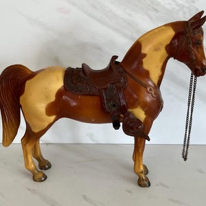Breyer Vintage Brown and Tan Plastic Horse with Original Saddle. 1950’s. Western Horse Collection. Unmarked . Read Listing.