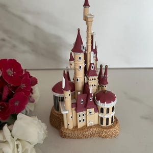 Hallmark “Castle in the Forest” Hallmark Light up Keepsake Ornament. Disneys Beauty and The Beast  2002. Box has writing on it.