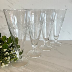 Footed Pilsner Beer or Iced Tea Glasses. Set of Four. Etched X’s with Etched Rings 1960’s