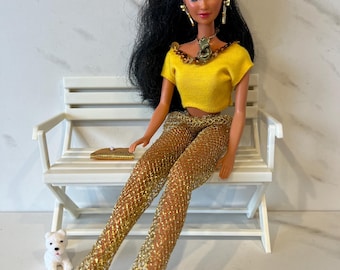 Vintage Sun Sensation Kira 1991 Barbie Doll. Brown Hair. Body is Marked Mattel 1966 Malaysia.