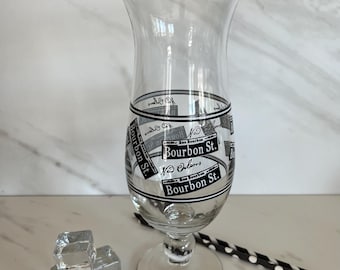 New Orleans Vintage Hurricane Pedestal Souvenir Glass. Black Graphics Featuring Famous Bourbon Street and Logo. 1980’s