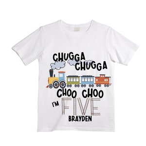May include: White t-shirt with a colorful train design and the text "Chugga Chugga Choo Choo I'm Five Brayden".