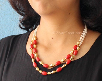 Coral-Colored Fusion Necklace: Traditional Elegance with a Contemporary Twist